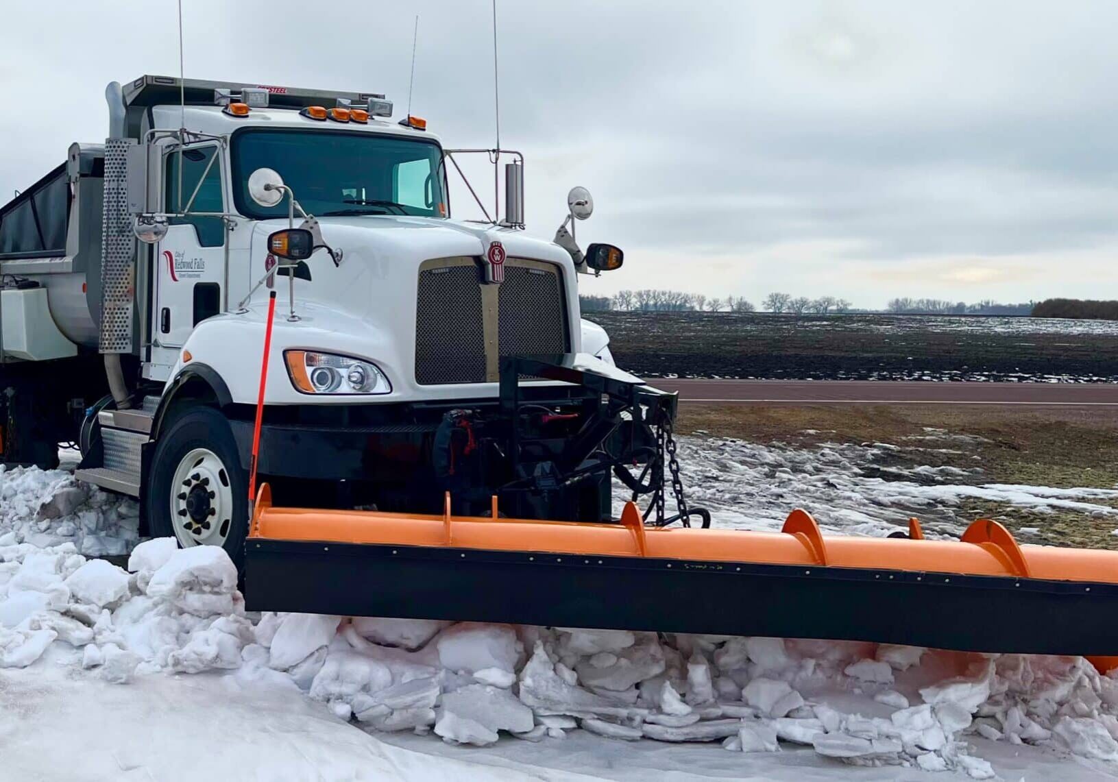 City of Redwood Falls Plow truck pushing snow on road